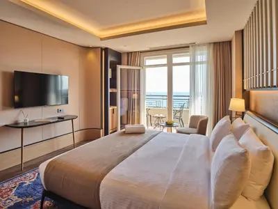 a hotel room with a large bed and a television at Four-G Hotel Premium in Istanbul