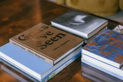 four books stacked on top of each other on a table at Eva Bosphora Waterfront Living in Istanbul