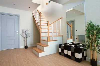 a room with a staircase with a black and white at Excellent Apartments Fatih Nova in Istanbul