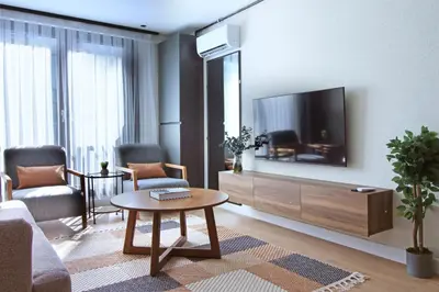 a living room with a tv and a coffee table at Excellent Apartments Fatih Nova in Istanbul