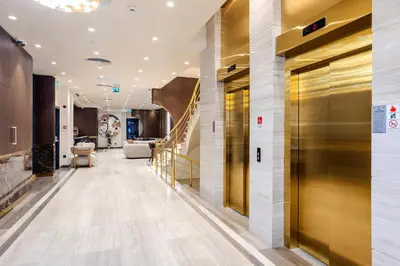 a lobby with a elevator in a building at Lions Royal Hotel in Istanbul