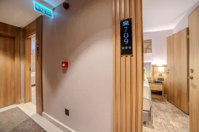 a hotel room with a sign on the wall at Lions Royal Hotel in Istanbul