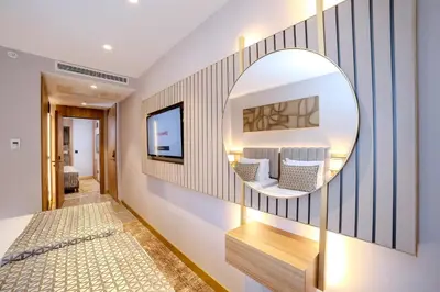 a mirror on a wall in a room at Lions Royal Hotel in Istanbul
