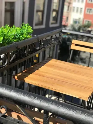 a wooden bench sitting on top of a balcony at Utarit Hotel in Istanbul