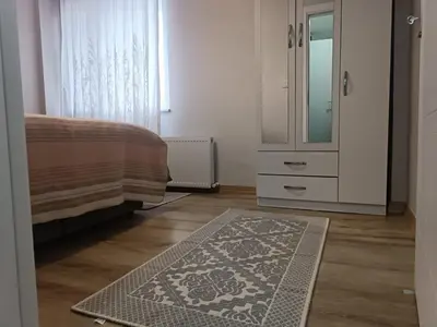 a living room with a dresser and a rug at Üsküdar'da Tam Size Göre S in Istanbul