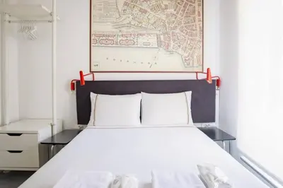 a bedroom with a white bed with a red headboard at Cute Compact 1Bd1Bath Gem Shared Terrace! #397 in Istanbul