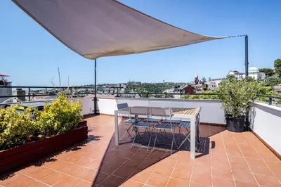 a patio with a table and chairs on a roof at Cool Charming Central 1BD1Bath Modern Home! #398 in Istanbul