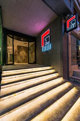 a building with a set of stairs in front of a store at Hotel Favori Nisantasi in Istanbul
