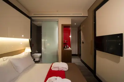 a hotel room with a bed and a television at Hotel Favori Nisantasi in Istanbul