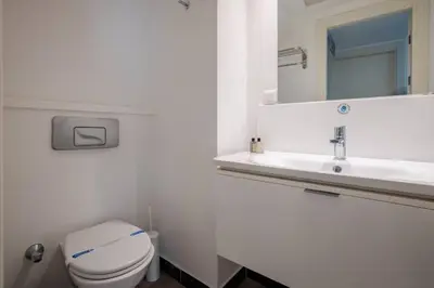 a bathroom with a white toilet and a sink at Cozy Coastal Hideaway with Bosphorus Breeze! #399 in Istanbul