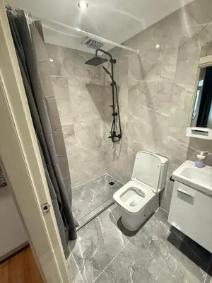 a bathroom with a white toilet and a sink at Serene aırbnb in Istanbul