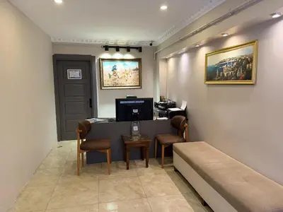 a waiting room with a table and chairs and a couch at Blue Istanbul Hotel Taksim in Istanbul