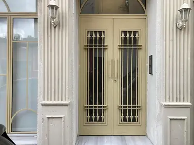 a yellow door on the side of a building at Balatella Suites in Istanbul