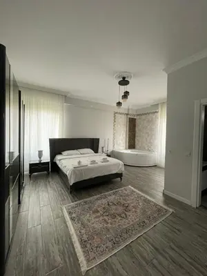 a bedroom with a bed and a bath tub at Villa akça in Kartepe