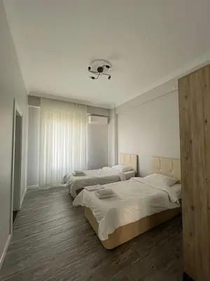 a bedroom with two beds and a light at Villa akça in Kartepe