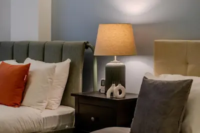 a lamp sitting on a table next to a bed at Bosphorus View with 3 Bedrooms and 2 Bathrooms in Istanbul