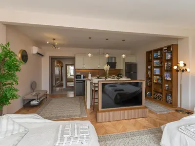 a living room with a large flat screen tv at sevim suites Nişantaşı Rumeli in Istanbul