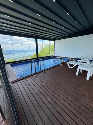 a large deck with a swimming pool on a boat at Adesa View Villas in Sapanca