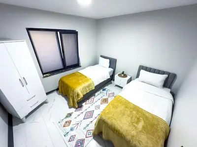 a bedroom with two beds and a window at Adesa View Villas in Sapanca