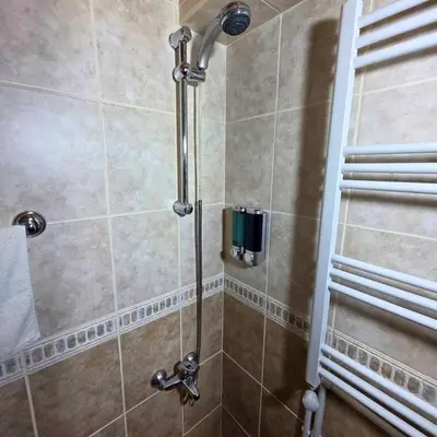 a shower with a glass door in a bathroom at Uludag Nefes Echoes by the Woods in Uludag