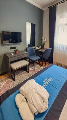 a hotel room with a bed and a desk at Balat Side Apart in Istanbul