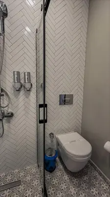 a bathroom with a toilet and a shower at Balat Side Apart in Istanbul