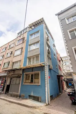 a blue building on the side of a street at 1st Floor Historic Flat in Old Istanbul in Istanbul