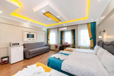 a living room with two beds and a couch at Kadirga Studios in Istanbul