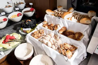 a buffet of different types of bread and pastries at Antusa Palace Hotel & Spa in Istanbul