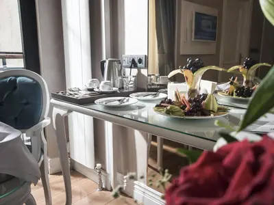 a table with plates of food on top of it at Antusa Palace Hotel & Spa in Istanbul