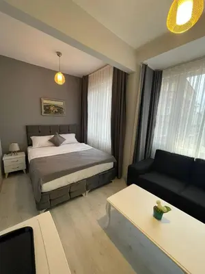 a hotel room with a bed and a couch at Oldmile Palace Hotel in Istanbul