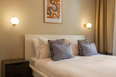 a bedroom with a bed with pillows on it at 3 Bedrooms and Central Location in Istanbul
