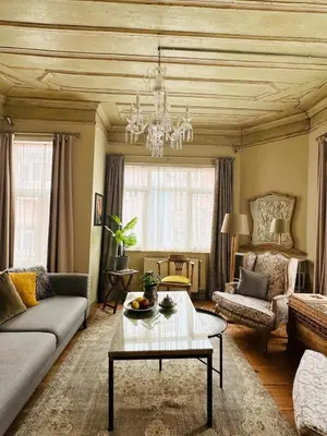 a living room with a couch and a table at Balat Istanbul Three-Story Restored Ottoman House in Istanbul