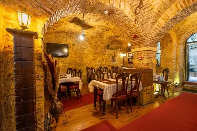 a dining room with a table and chairs in a building at Hotel Gedikpasa Family in Istanbul