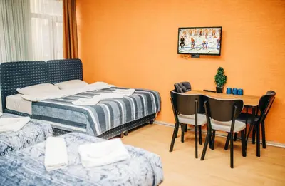 a bedroom with a bed and a table and chairs at Ekinoks Hotel in İznik