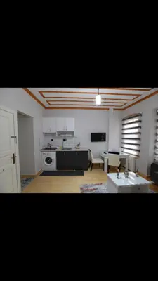 a room with a kitchen and a living room at Taksim Of The City in Istanbul