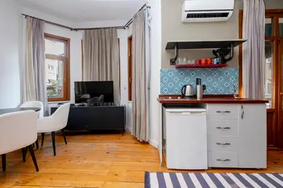 a kitchen with a counter and a table with chairs at Private Building Featuring Two Separate Apartments in Istanbul