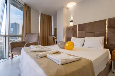 a hotel room with a bed with a yellow ball on it at Mall Off Palace in Istanbul