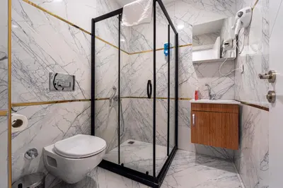 a bathroom with a shower and a toilet at Mall Off Palace in Istanbul