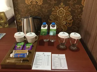 a table with two bottles of water and two glasses at Alrazi Hotel in Istanbul