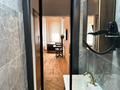 a bathroom with a sink and a mirror at MorAgop Suites in Istanbul