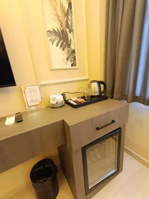 a desk in a hotel room with a coffee maker on it at City Hotel İstanbul in Istanbul