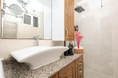 a bathroom with a white sink and a mirror at Bosphorus View - Central Location - 3 Bedrooms in Istanbul