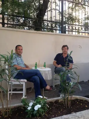 a couple of men sitting in chairs around a table at Galley Hotel in Istanbul