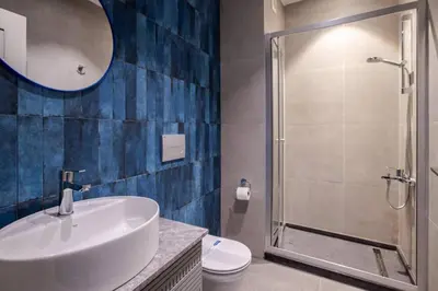 a bathroom with a sink and a shower and a toilet at Cozy Prime Location 1BD1Bath Sweet Home! #404 in Istanbul