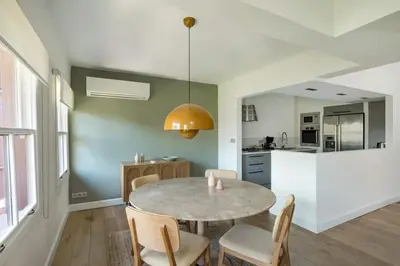 a kitchen and dining room with a table and chairs at Beautiful Modern Bright 2BD Patio Duplex #179 in Istanbul
