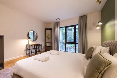 a bedroom with a white bed and a window at Galata 21 in Istanbul