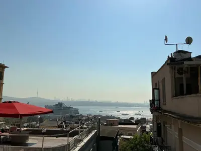 a view of the water with a cruise ship in the distance at Galata 21 in Istanbul