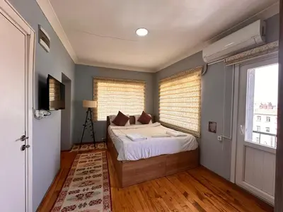 a bedroom with a bed and a window at Lavina Apartment in Istanbul