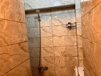 a shower with a glass door in a bathroom at Lavina Apartment in Istanbul